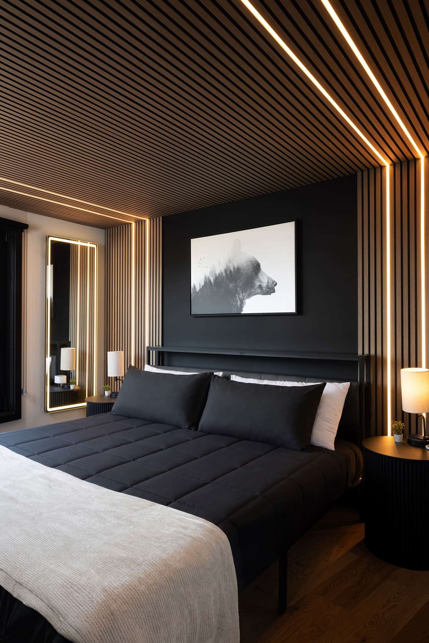A bedroom with timber walls